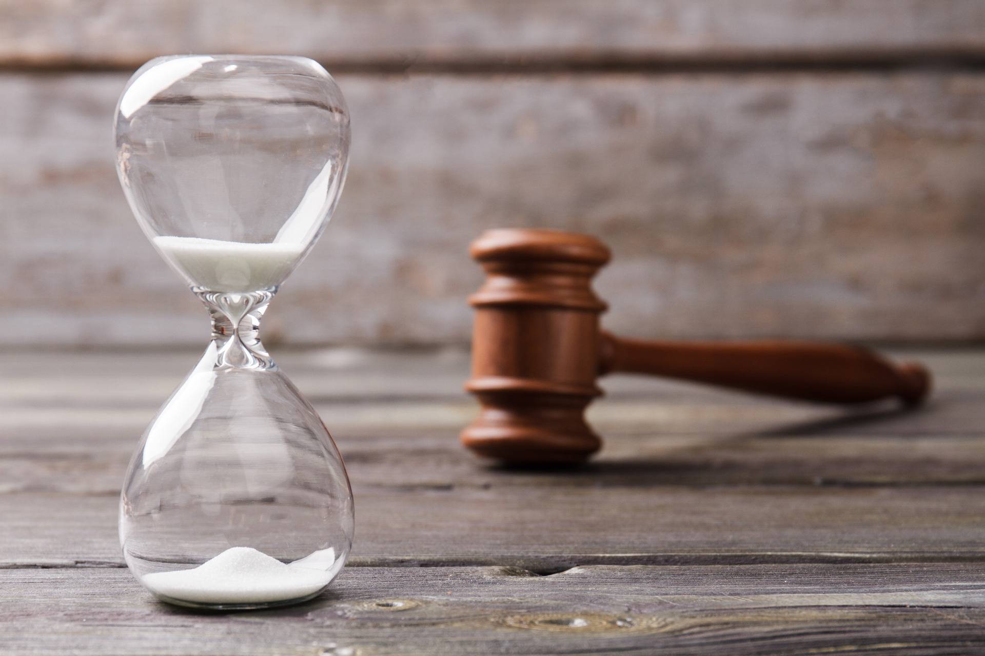 hourglass and judge gavel