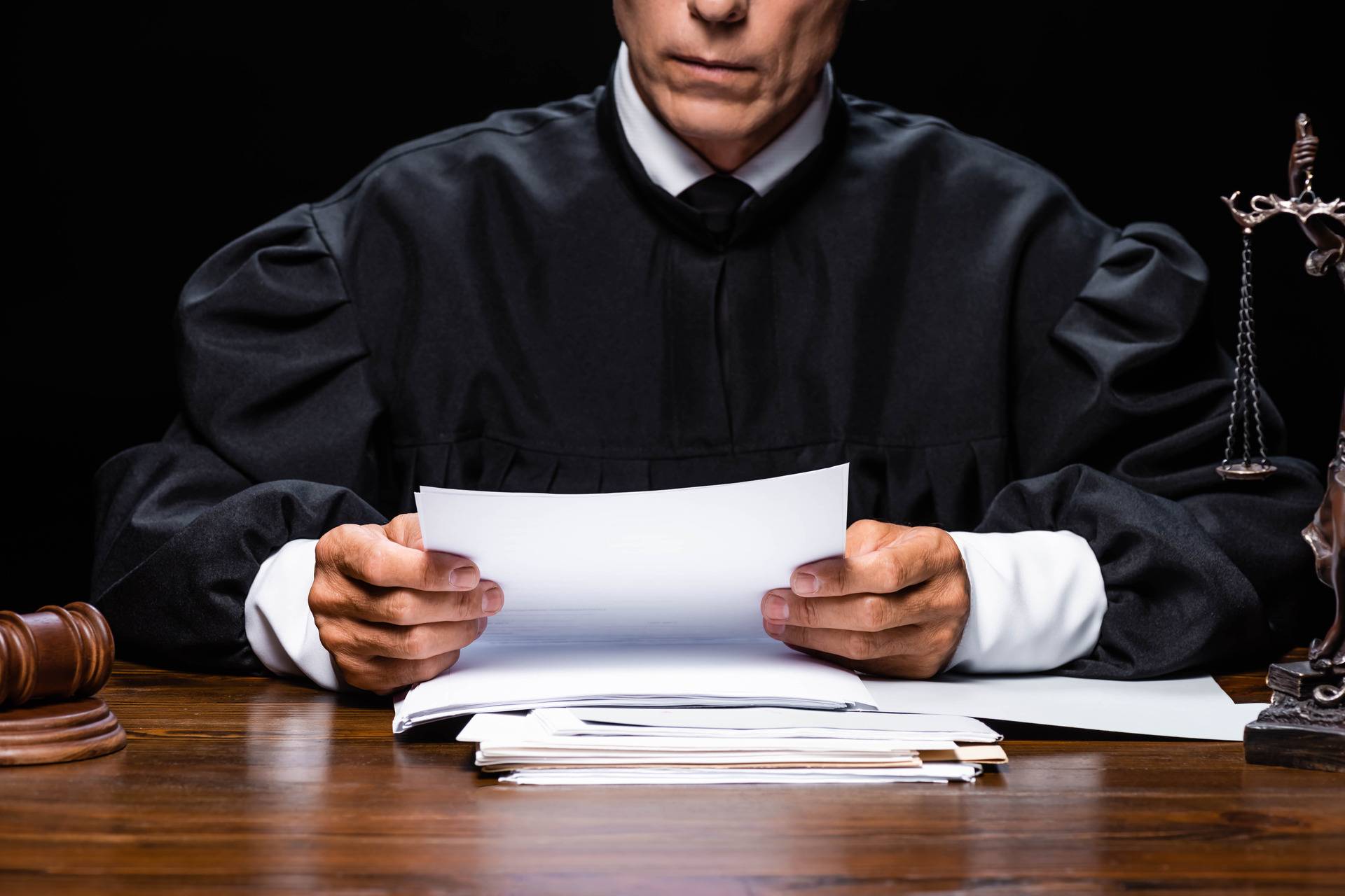 judge sitting and reading letter