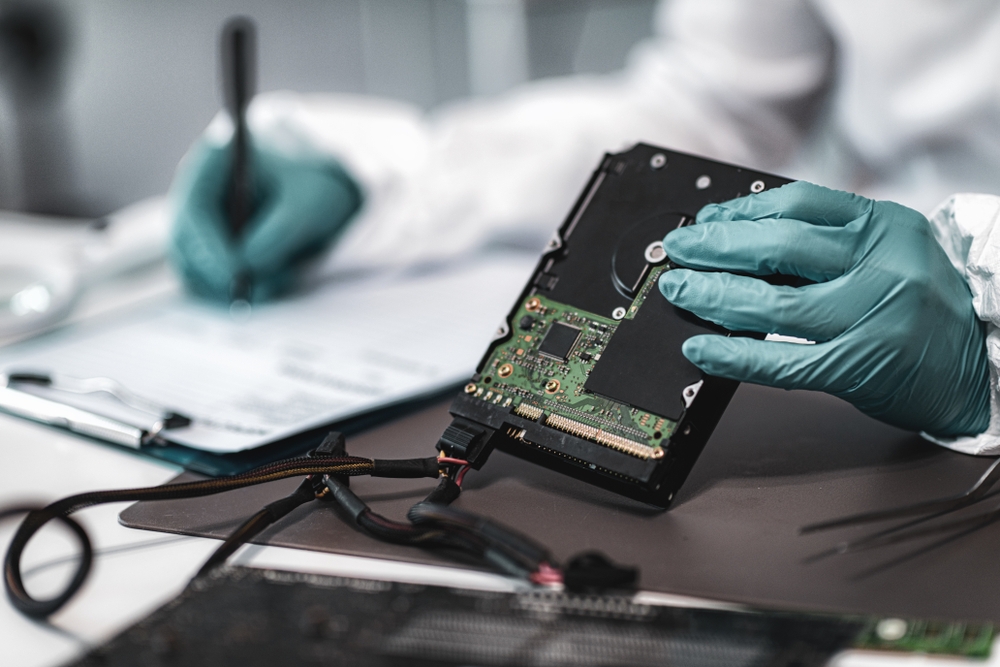 Forensic investigator documents hard drive for evidence